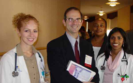 Hospital administrator standing with doctors